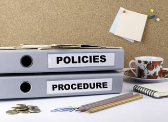 two files with tags policies and procedures on them